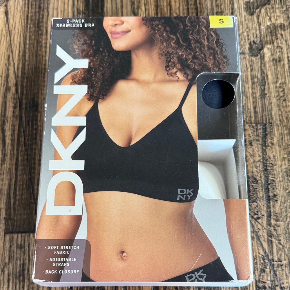 New in Box. DKNY 2 Pack Seamless V‑Neck Stretch Bra. One Black and one Cream.